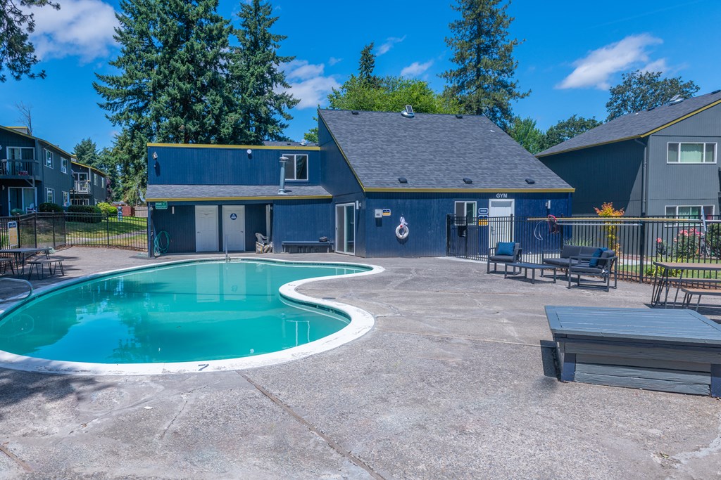 take a dip in the pool at the whispering winds apartments in pearland, tx