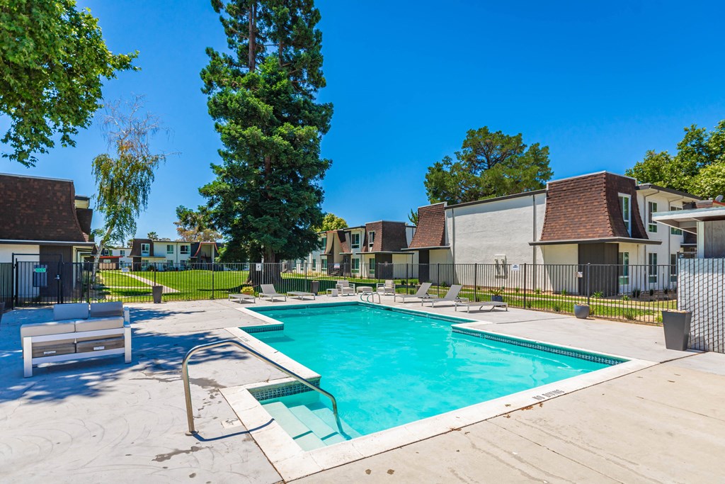 take a dip in the resort style pool at the enclave at woodbridge apartments in sugar land