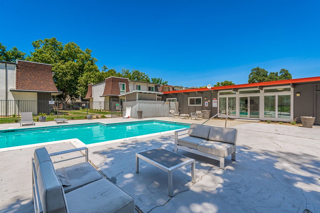 take a dip in the pool at the whispering winds apartments in pearland, tx