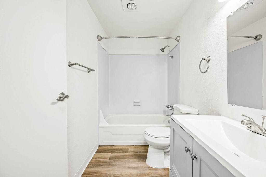 a bathroom with a toilet sink and bathtub