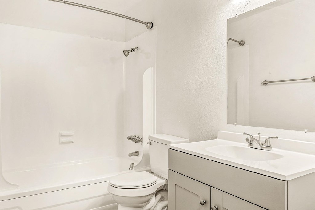 a bathroom with a sink toilet and bathtub