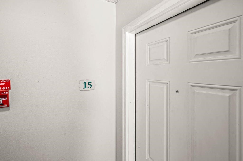 a white door with a number 15 on it
