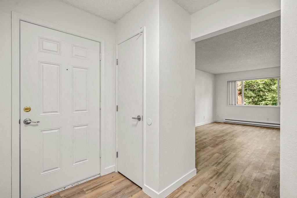 an empty room with a door open