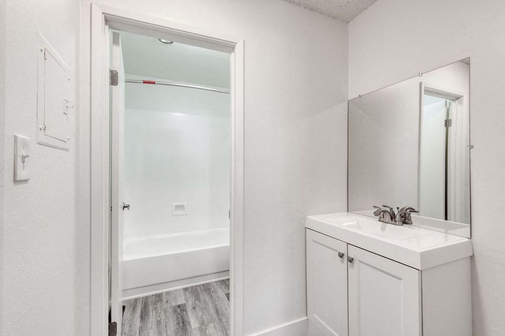 a bathroom with a sink and a bathtub