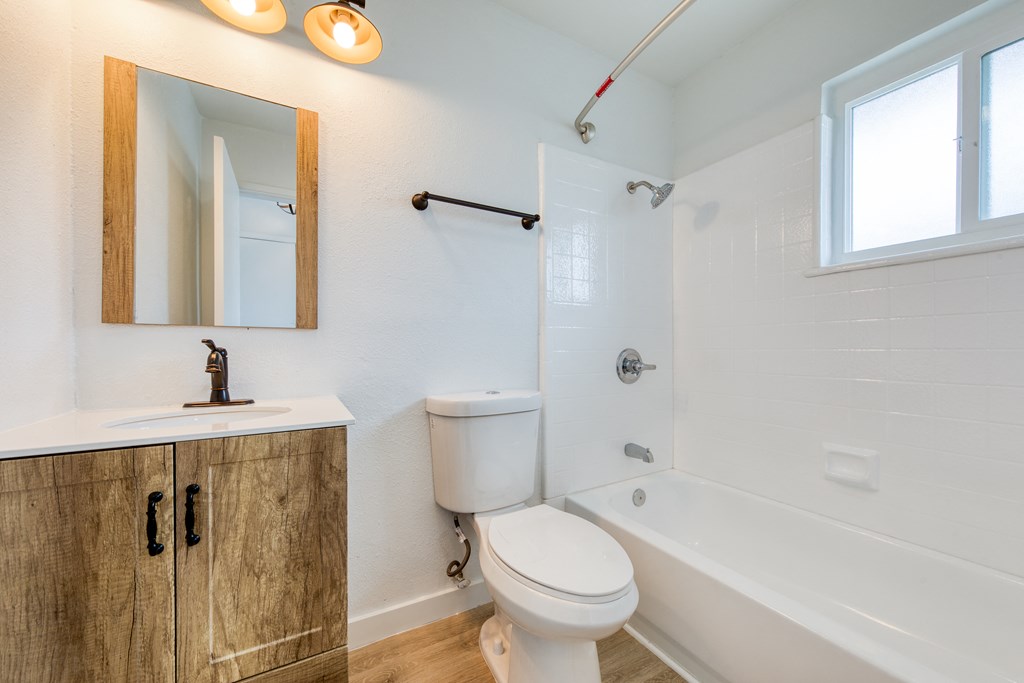a bathroom with a toilet sink and bathtub
