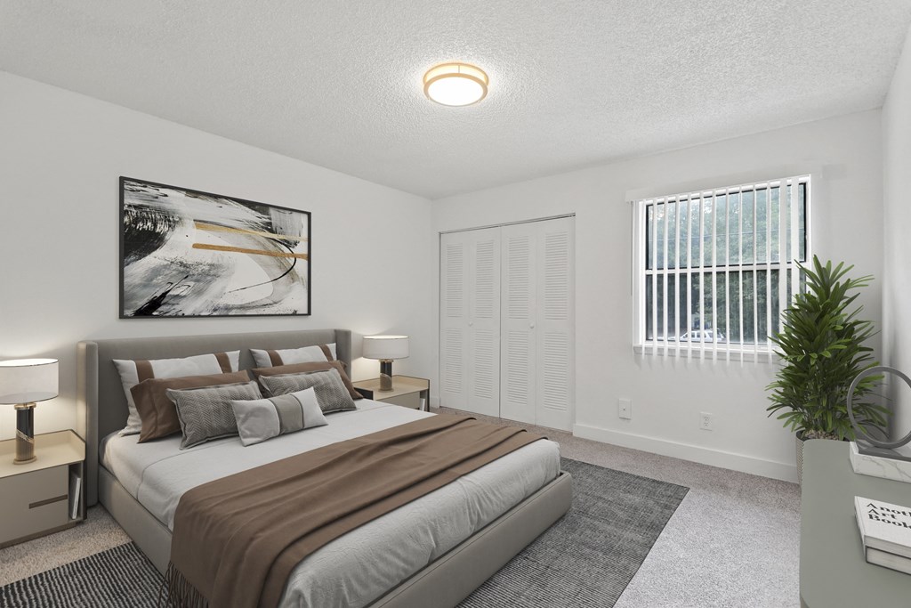 a bedroom with a large bed and a window