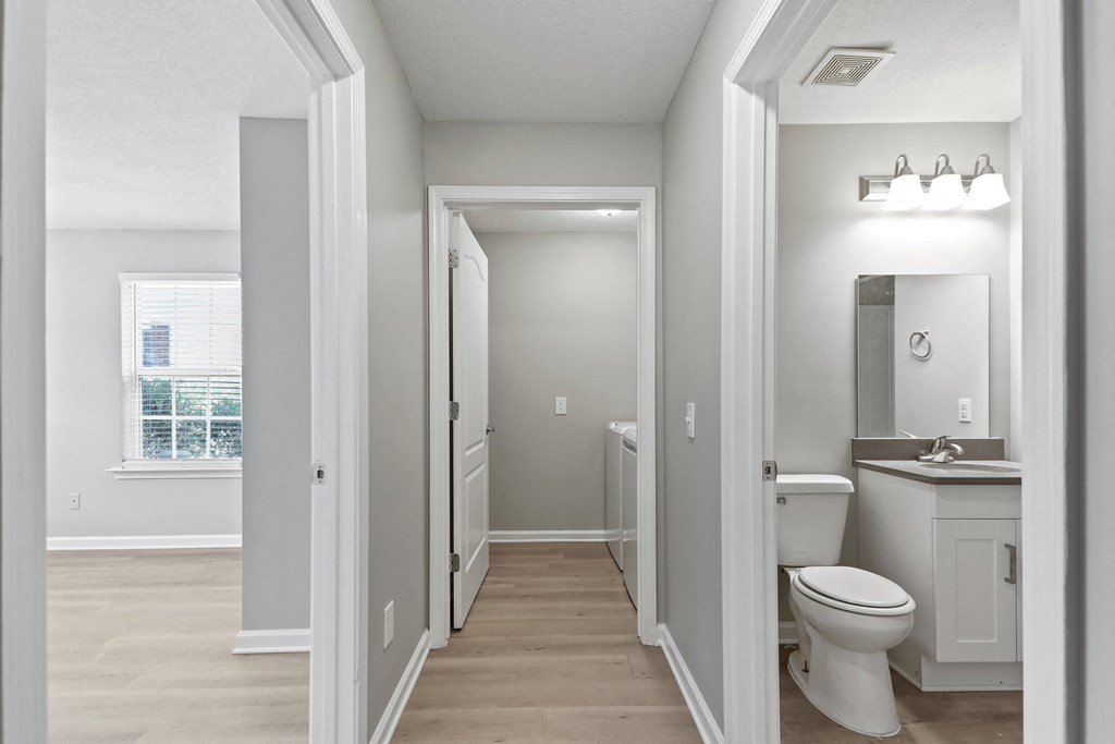 a renovated bathroom with a toilet and a sink in a house