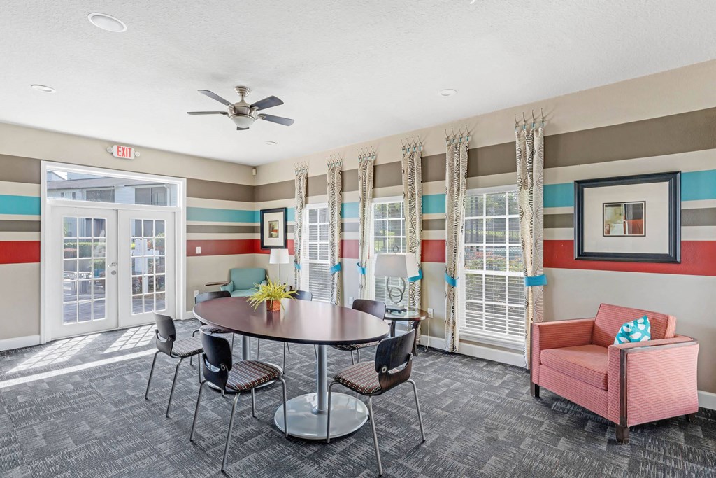 a dining room with a table and chairs