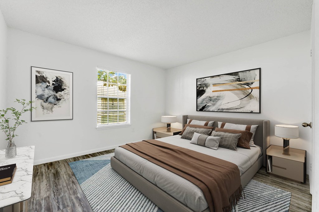 a bedroom with a large bed in front of a window