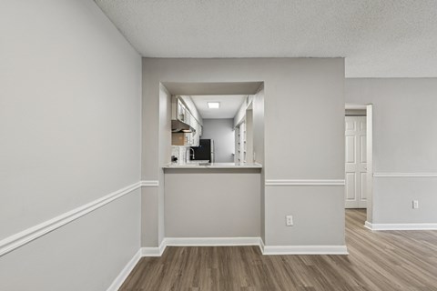 A kitchen area with a counter and a microwave.