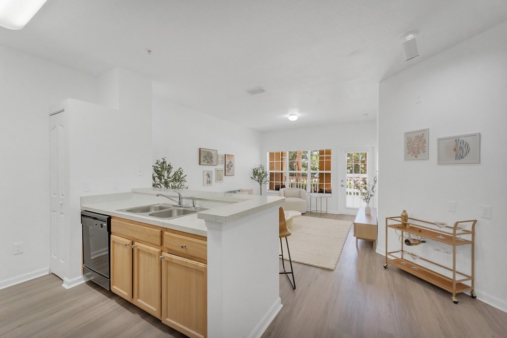 a kitchen and living room in a 555 waverly unit