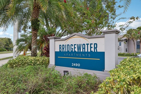 A sign for Bridgewater Apartments with the number 2490 on it.