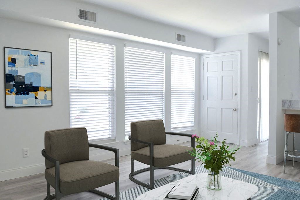 a living room with two chairs and a coffee table
