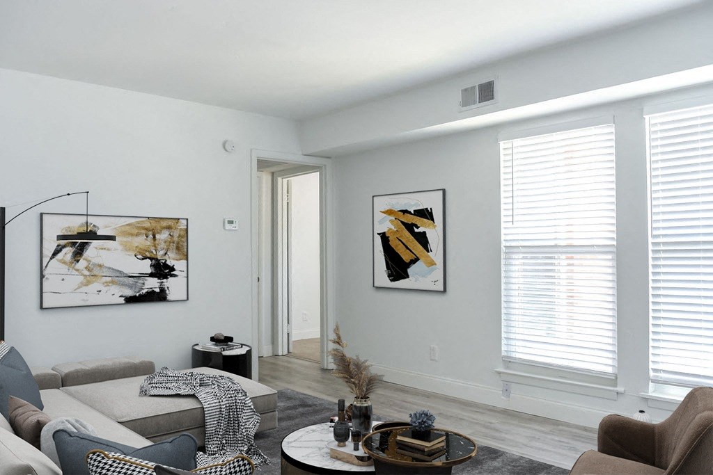 a living room with gray walls and white trim