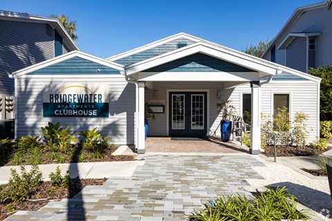 the entrance to bridgewater at gardner condos in front of a white building with