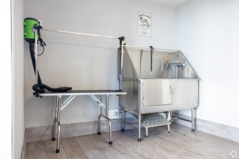 a stainless steel sterilization unit in the corner of a room