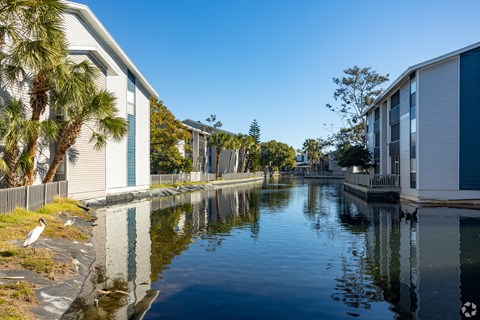 a canal with houses on the side of it