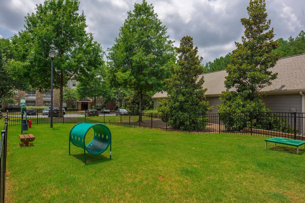 our apartments have a park with a playground and a green slide