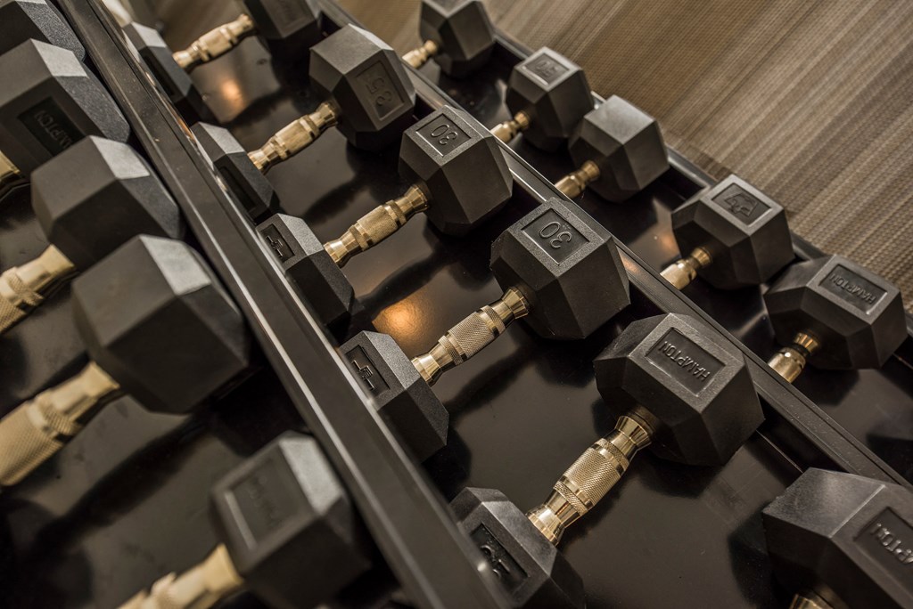 a row of weights on a gym machine