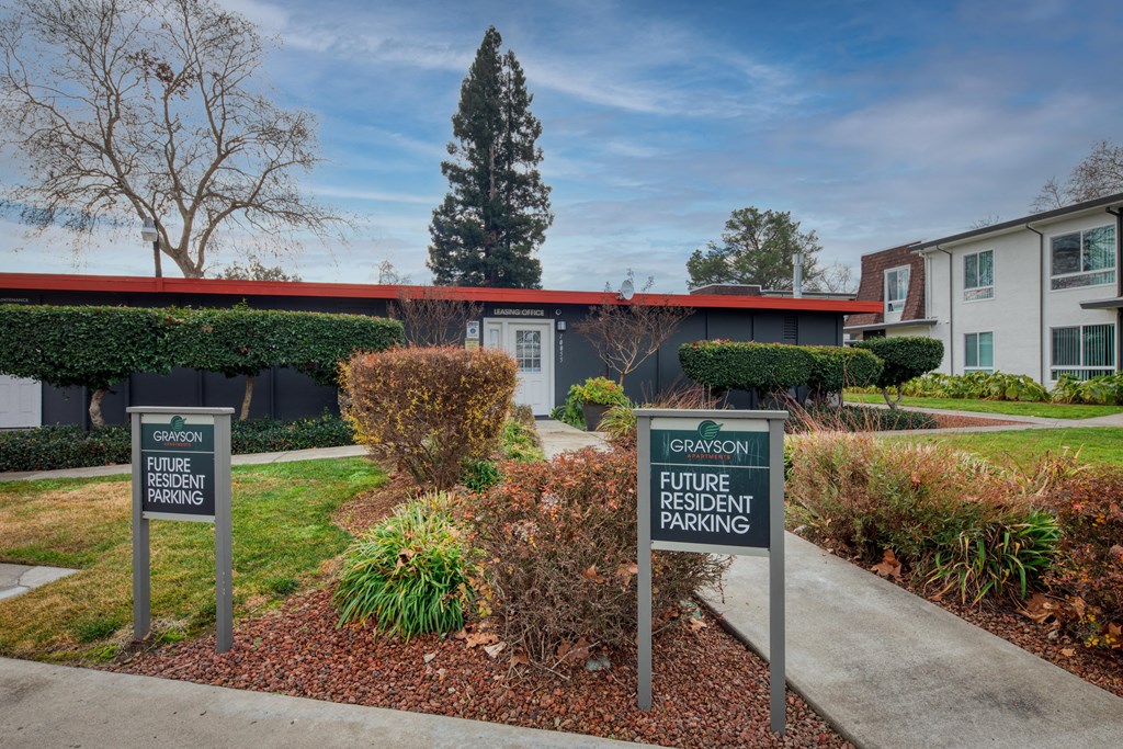 a building with two signs in front of it