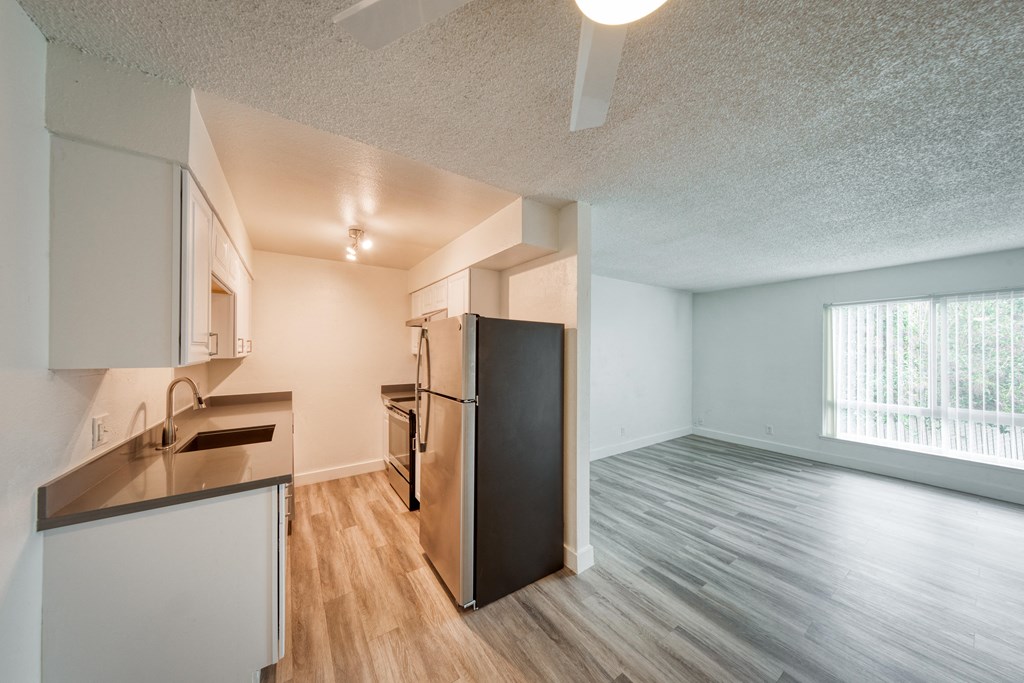 a kitchen and living room in a 555 waverly unit