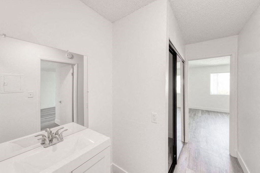 a bathroom with a sink and a mirror