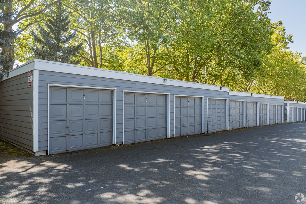 A long row of garage doors are closed.