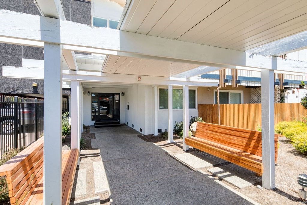 a building with a wooden bench in front of it
