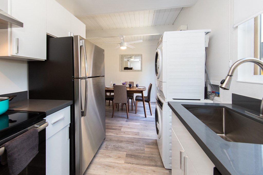 a kitchen and dining area in a 555 waverly unit
