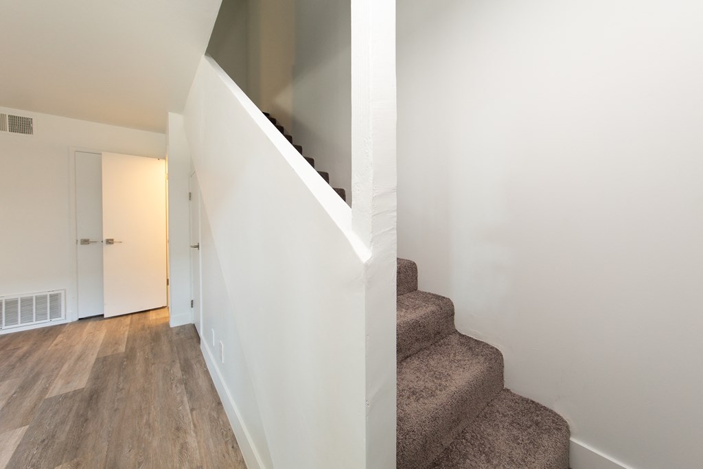 a view from the bottom of the stairs in a 555 waverly unit