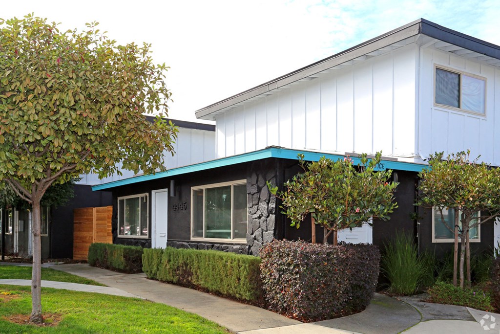 a building with a blue awning in front of it