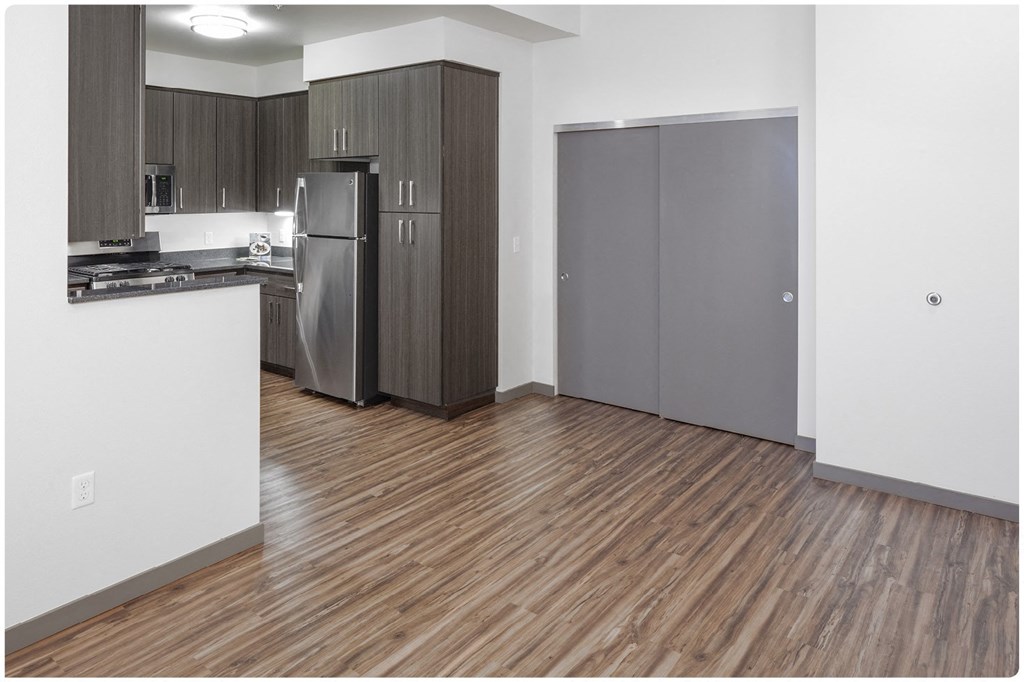 a kitchen with a refrigerator freezer and a sink