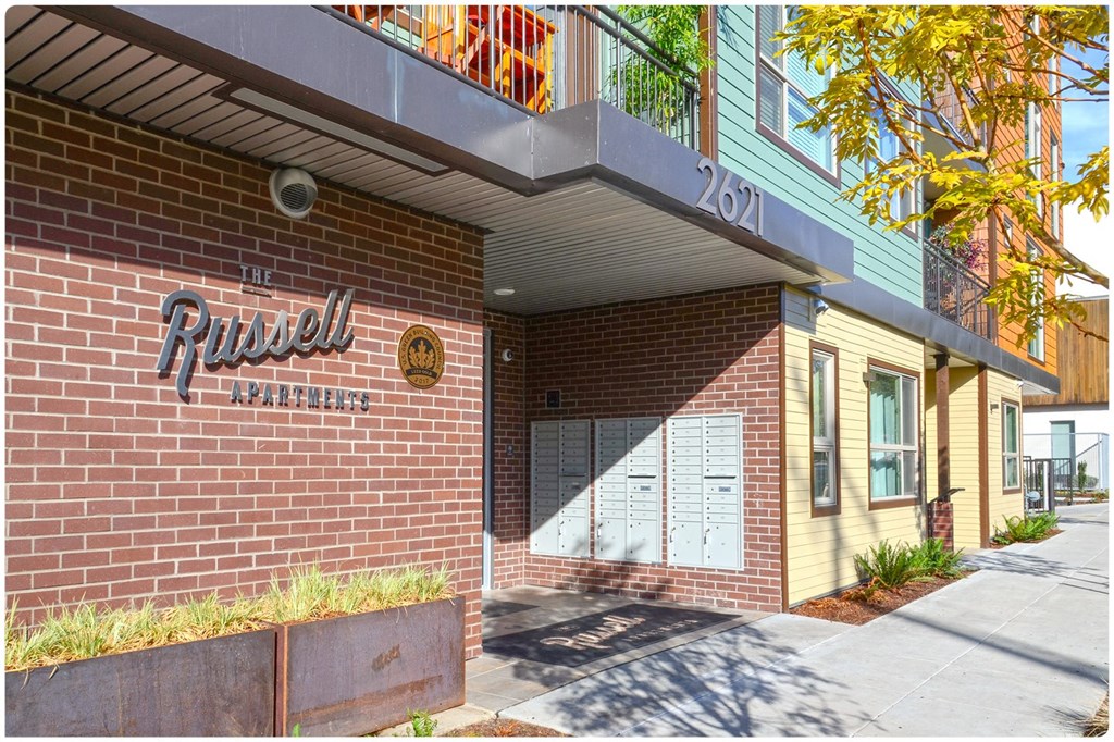 a brick building with a sign that reads prudential apartments