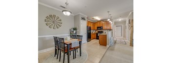 an open kitchen and dining room with a table and chairs