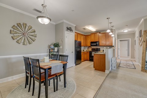 an open kitchen and dining room with a table and chairs