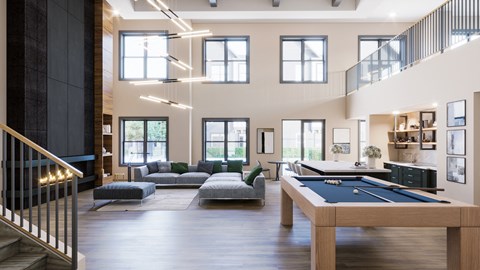 A large room with a pool table and a staircase.