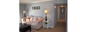 a living room with a couch and a table