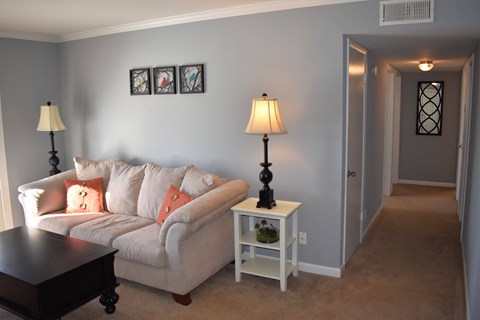 a living room with a couch and a table