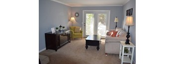 a living room with a couch and a table