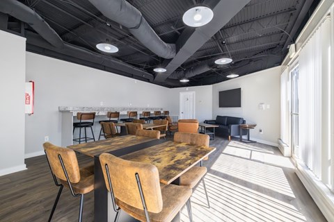 A conference room with a long table and chairs.