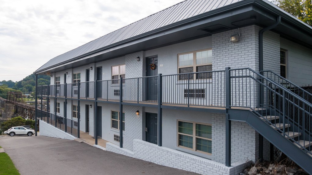 the front of a building with two sets of balconies