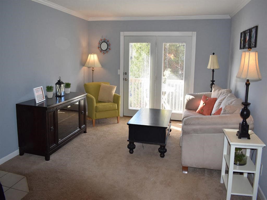 a living room with a couch and a table