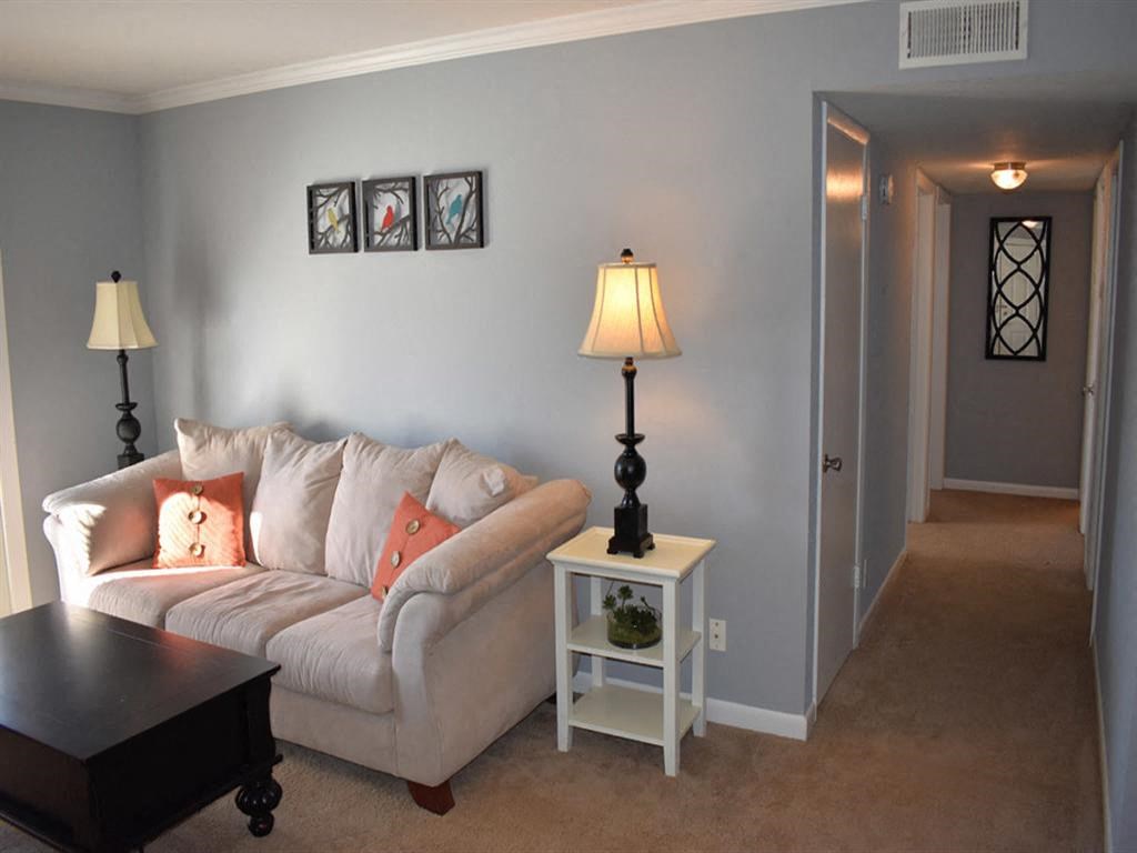 a living room with a couch and a table