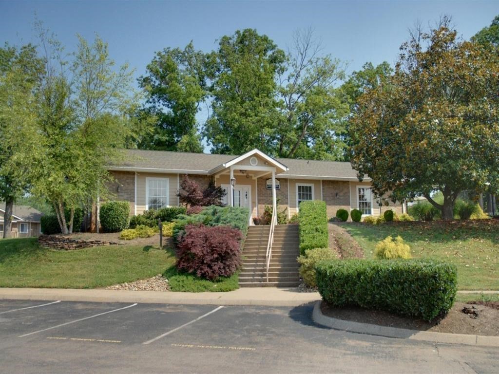 a small house with stairs in front of it