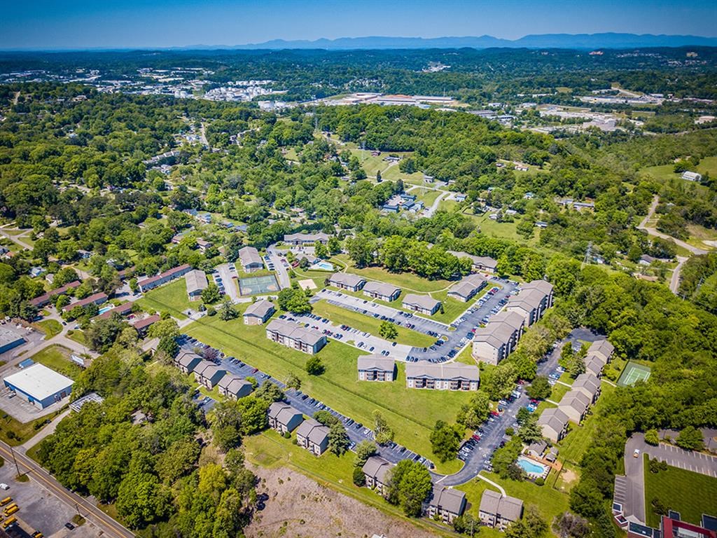 an aerial view of a neighborhood with houses and trees