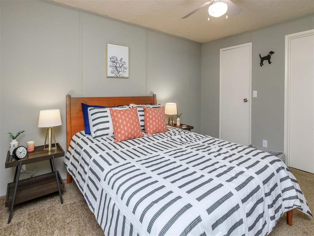 a bedroom with a bed and a closet