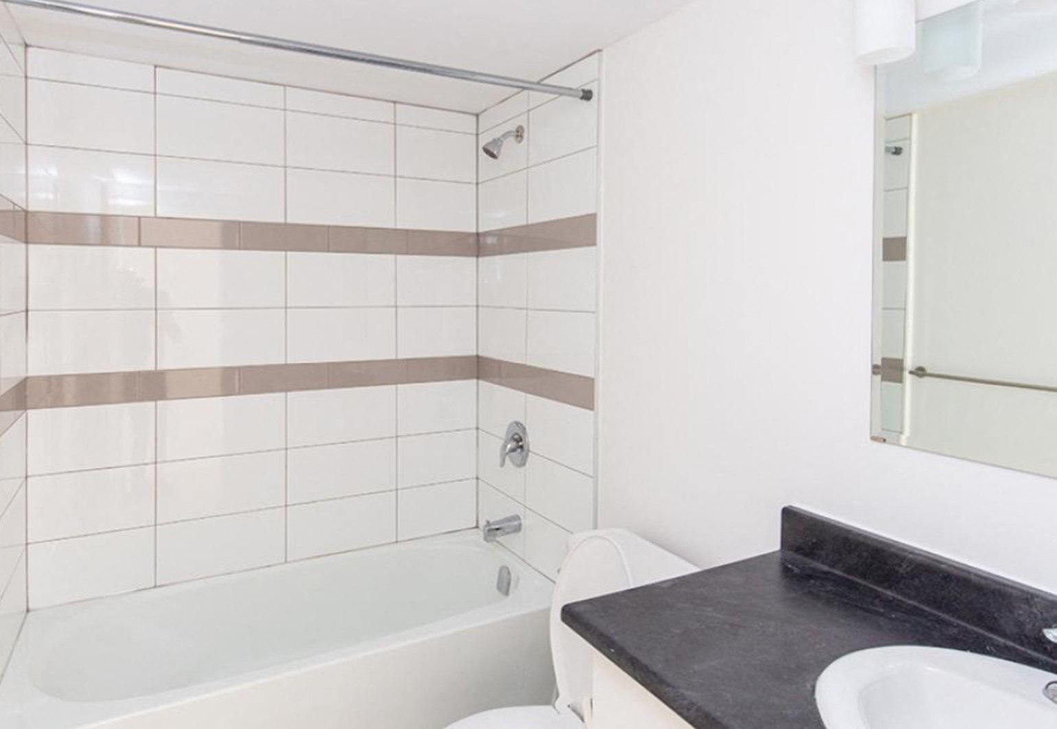 a bathroom with a bathtub and a sink