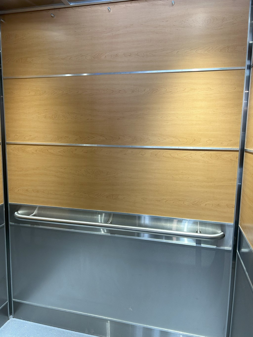 a close up of the wood paneling on the wardrobe doors