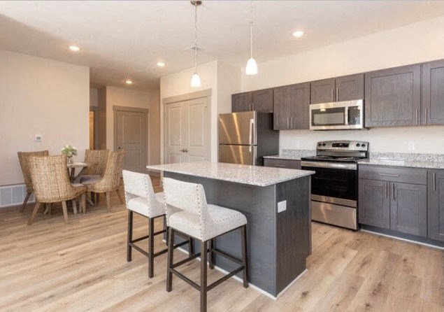 a kitchen and dining area with a large island