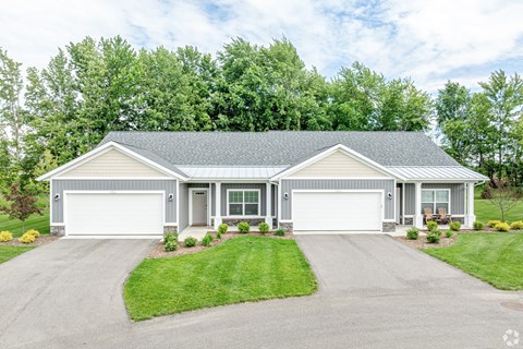 A two-car garage is attached to a house.